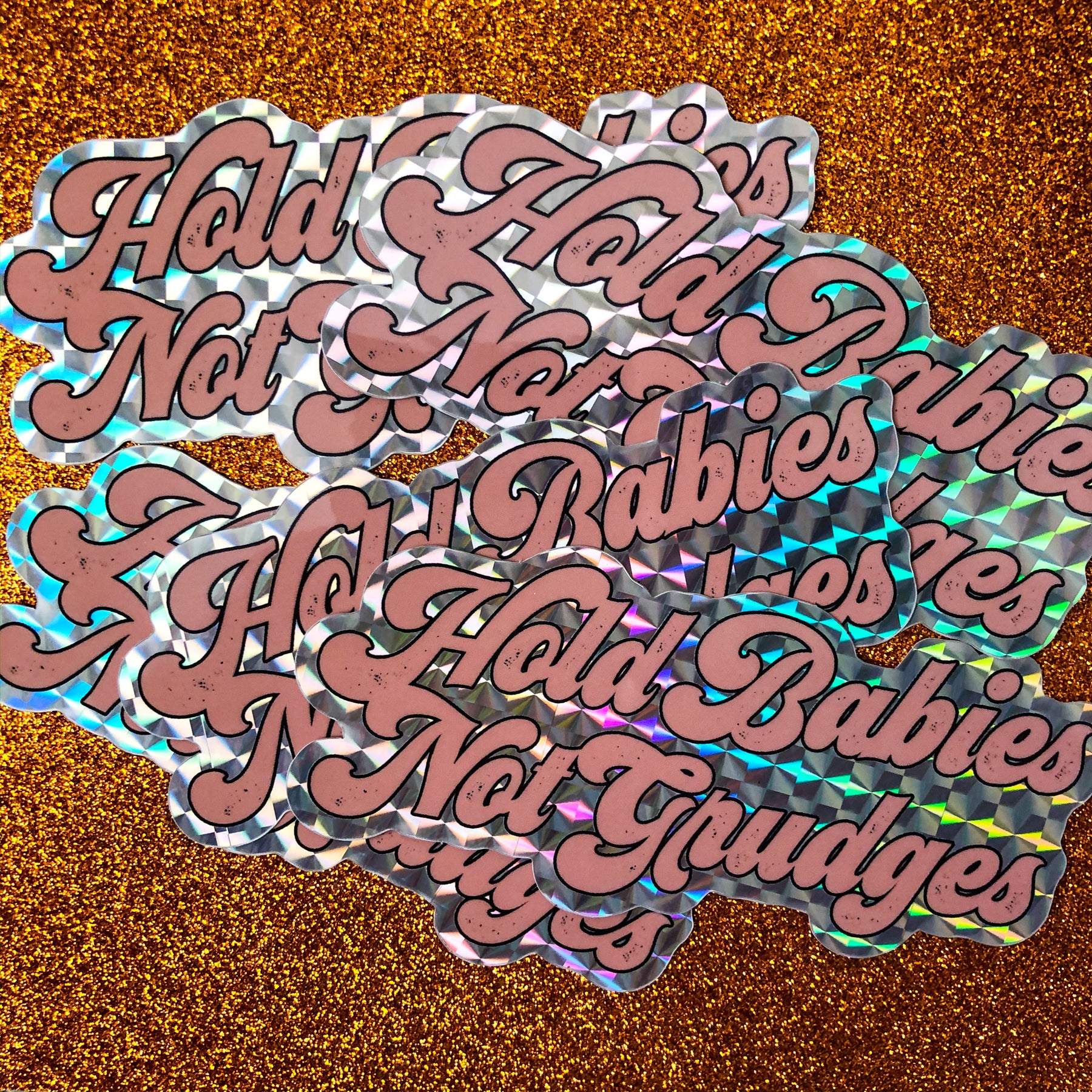 hold babies not grudges sticker
